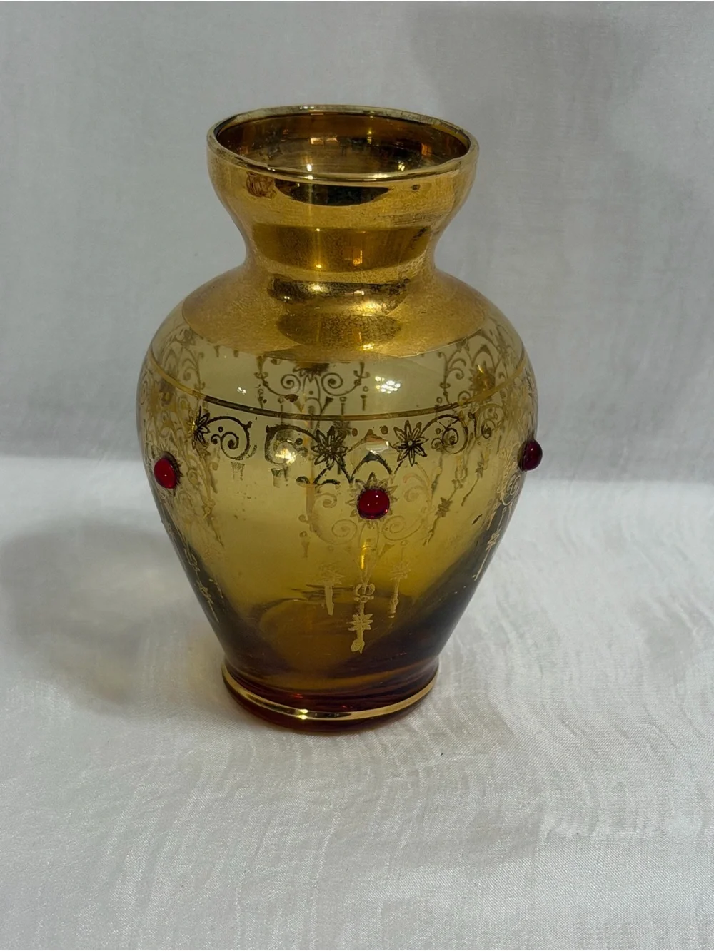 Vecchia Murano vintage amber glass vase with 24K gold trim and red cones.